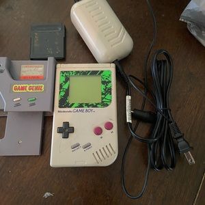 GameBoy with game genie and games